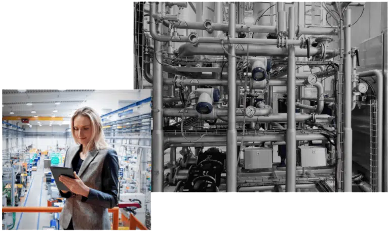 A woman holds a tablet in an industrial setting, efficiently managing CPQ software. To the right, machinery with pipes and gauges from fluid handling equipment manufacturing is visible.