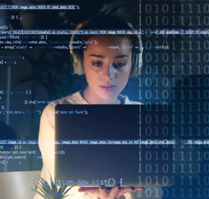 A woman, immersed in quoting software, wears headphones while focused on her laptop screen. Computer code and binary numbers are seamlessly overlaid on the image, symbolizing a digital symphony of data.