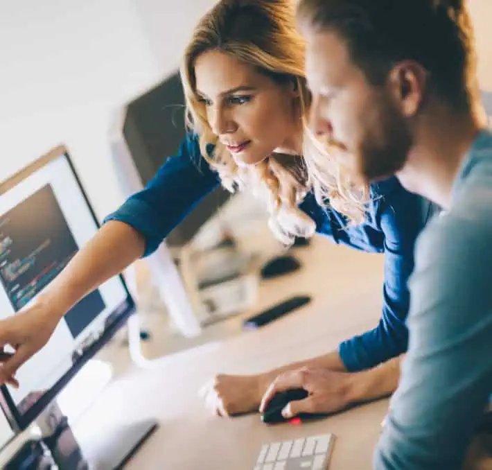 Woman pointing to computer screen