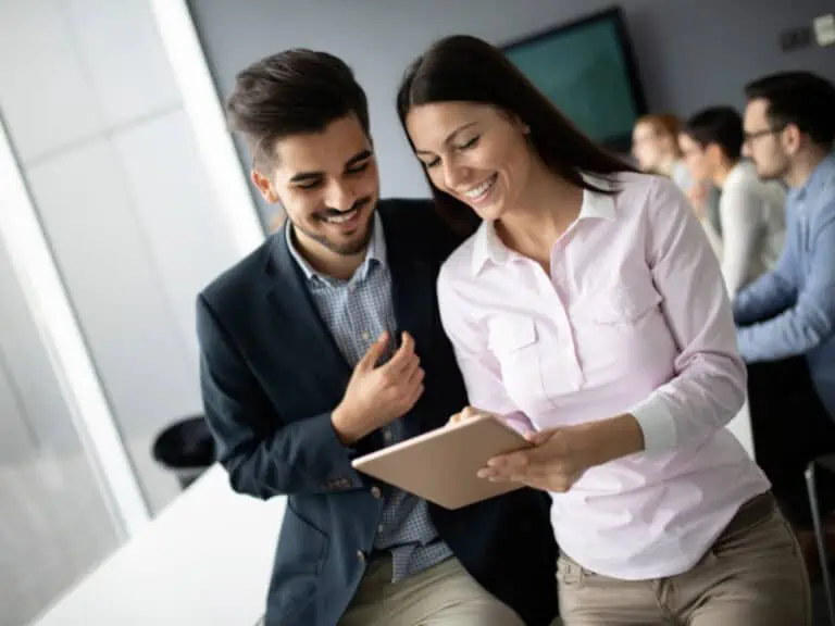 Man and woman looking at a tablet