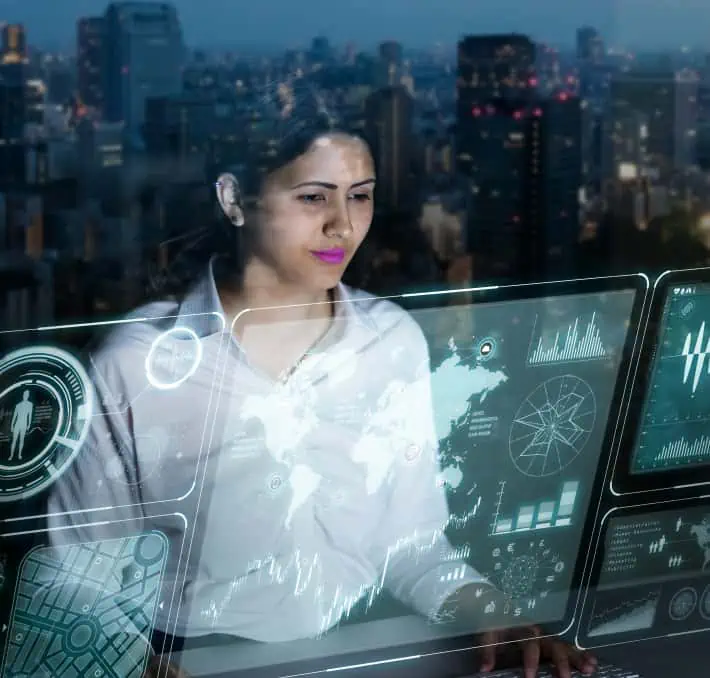 Against a cityscape backdrop at night, a woman engages with a digital touchscreen showcasing global maps and data charts. This interactive experience, reminiscent of a digital twin for fluid environments, offers deep insights into dynamic systems.