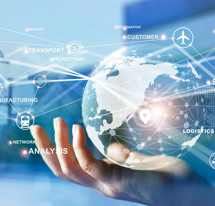 A hand holds a holographic globe showcasing interconnected icons, depicting elements of supply chain management like logistics, transport, and analysis against a blurred blue background.