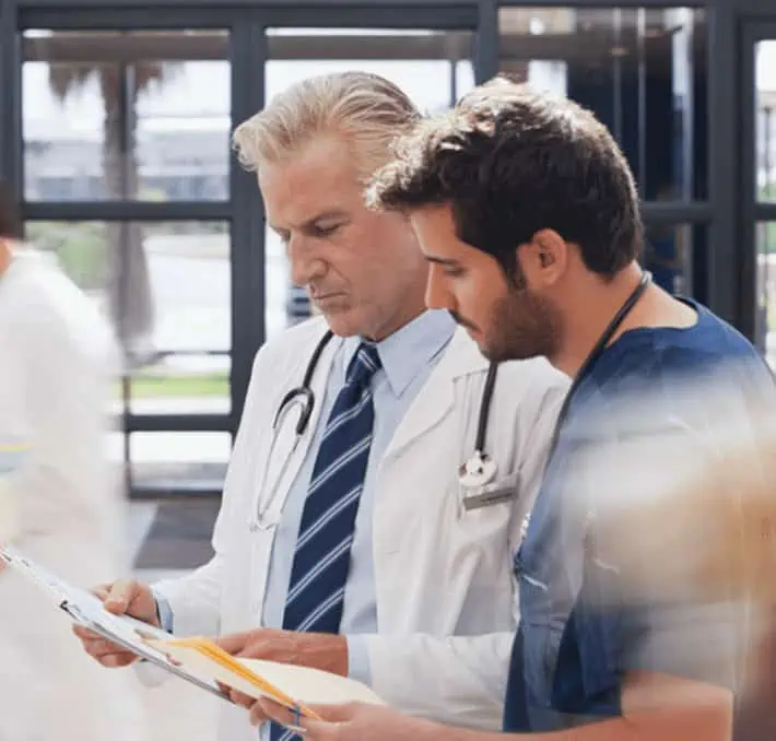 Doctors looking at charts