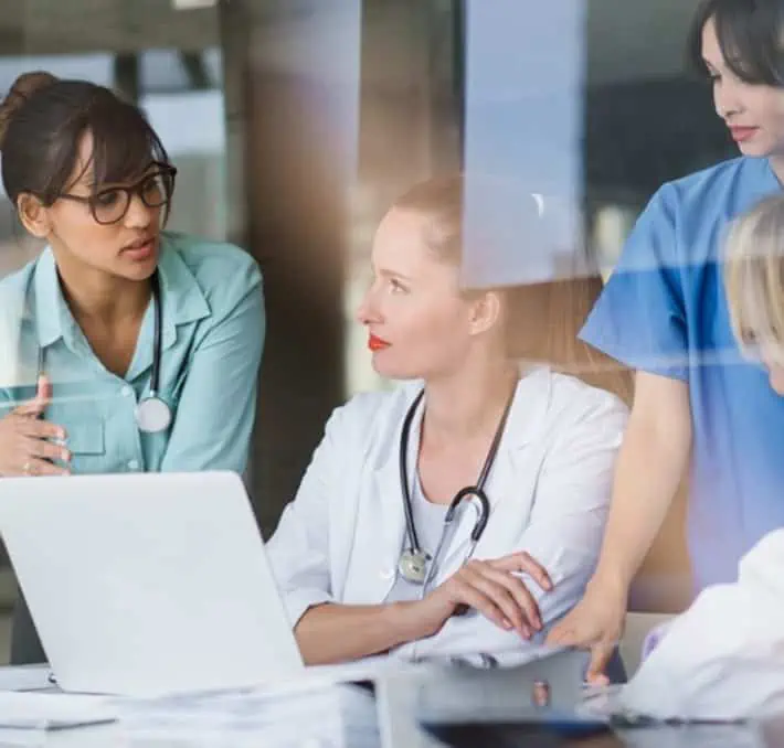 Dr and nurses in discussion