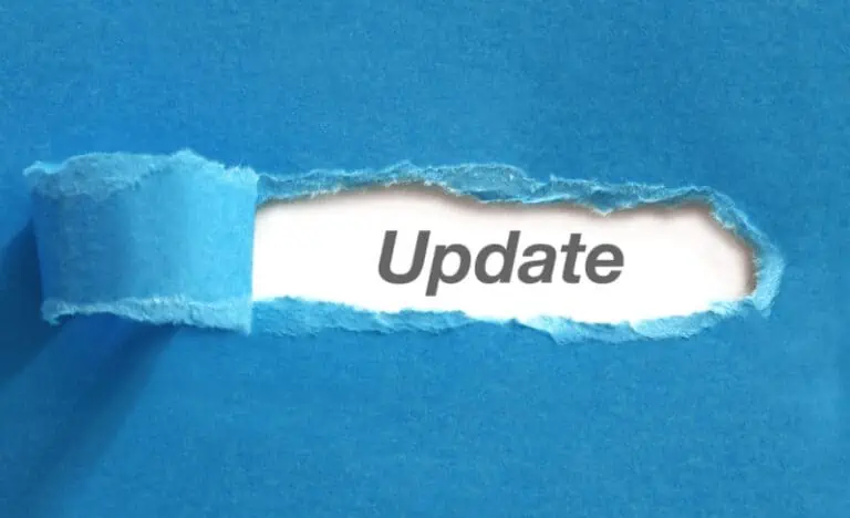 A piece of blue paper is torn to reveal the word Update beneath it.