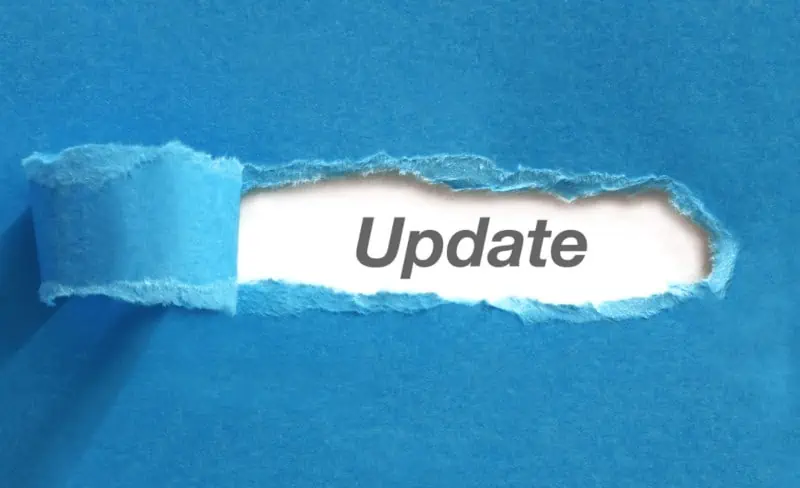 A piece of blue paper is torn to reveal the word Update beneath it.