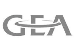 A group of people on a stage with musical instruments and microphones, performing under bright lights.