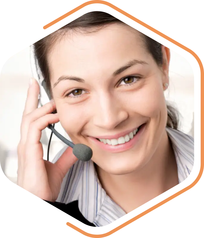 A person smiling warmly, wearing a headset with a microphone, ready to assist as part of the TENADO Service.