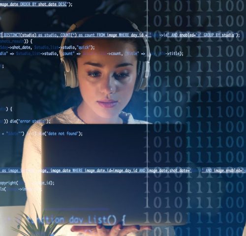 A person wearing headphones works on a laptop, surrounded by digital binary code and quoting software scripts on a transparent screen.